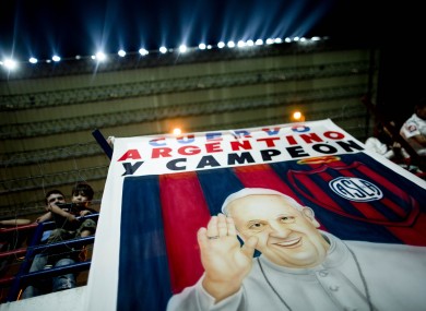 A banner with an image of Pope Francisat an Argentine league game.