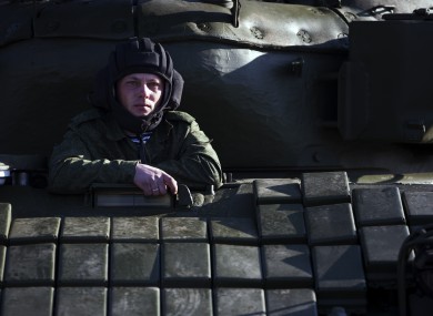 A Russian solder sits in the tank T-72B at the Ostryakovo railway station not far from Simferopol, Crimea.