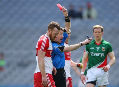 Padraig Hughes issues a red card to Fergal Doherty.