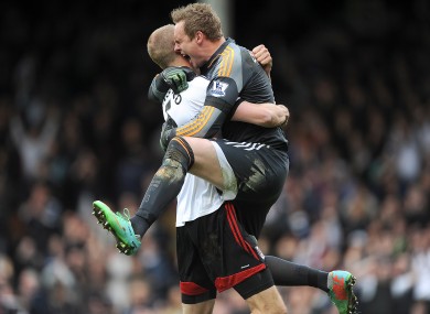 Fulham's Brede Hangeland and team-mate David Stockdale celebrate wildly after the final whistle.