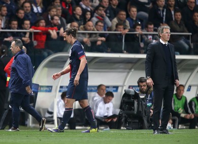 Zlatan Ibrahimovic walks past Lauren Blanc as he is taken off.