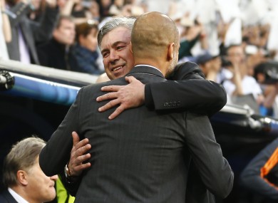 Real's coach Carlo Ancelotti hugs Bayern head coach Pep Guardiola tonight.
