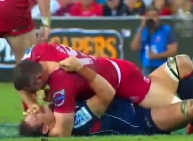 Ed O'Donoghue claws at Scott Higginbotham's face.