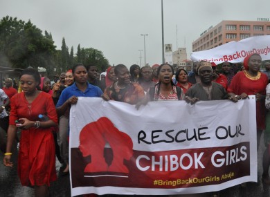 Women attend a demonstration calling on the government to rescue kidnapped schoolgirls.