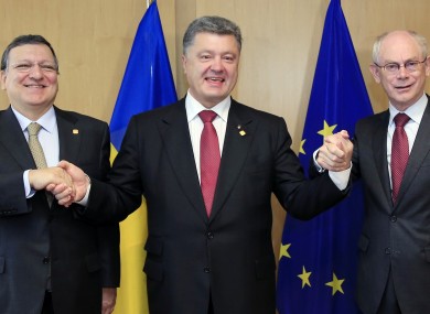 Ukraine's President Petro Poroshenko, center, poses with European Commission President Jose Manuel Barroso, left, and European Council President Herman Van Rompuy.