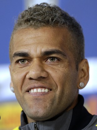 Brazil's Dani Alves looks on during a news conference at the Granja Comary training centre in Teresopolis, Brazil.