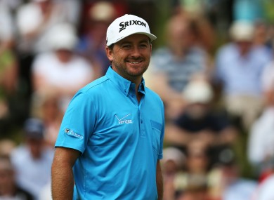 Graeme McDowell breaks into a smile after a birdie putt finally drops on 16.