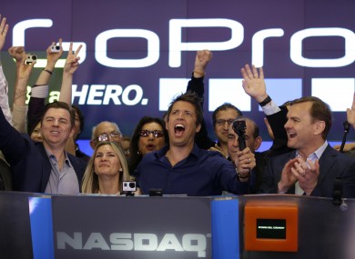GoPro CEO Nick Woodman (centre) celebrates with his company going public.