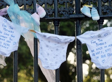 Items of baby clothing were tied to the railings at the back of Leinster House this evening, where a vigil was held to demand justice for the mothers and children who endured cruelty at the hands of the State.