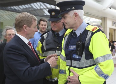 Enda Kenny meeting gardaí while canvassing in May.