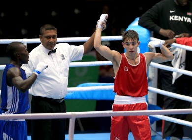 Michael Conlan celebrates winning his match against Uganda's Bashir Nasir.