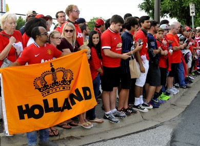 United fans in Maryland wait for the players and their new boss earlier this week.