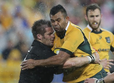 Australia's Kurtley Beale collides with Richie McCaw in Sydney.