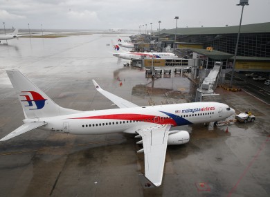 A Malaysia Airlines Boeing 737-800 plane sits on tarmac at Kuala Lumpur International Airport in Sepang, Malaysia