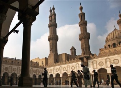 Muslims arrive to attend the Friday prayer at Al-Azhar mosque in Cairo, Egypt.