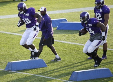 Minnesota Vikings running backs Adrian Peterson and Matt Asiata work out.