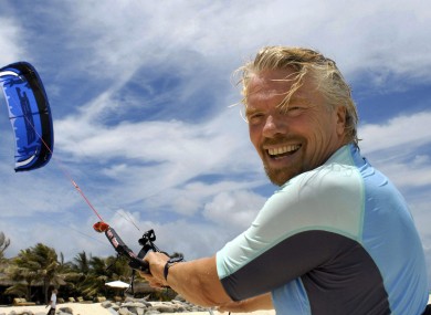 Richard Branson takes his holidays on Necker Island, so he probably will be taking advantage of his policy.