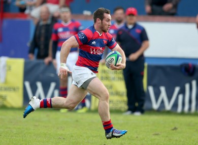 Rob McGrath sprints home for a Clontarf try against Young Munster.