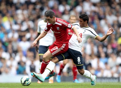 Tottenham Hotspur's Paulinho (right) and West Browmich Albion's Graham Dorrans battle for the ball during during the Barclays Premier League match at White Hart Lane.