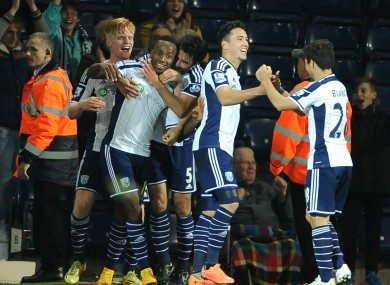 The West Brom players celebrate.