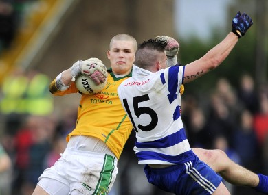 Jack Hannigan clashes with Jake Regan during today's game.