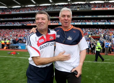Cunningham, left, and old friend JBM will go head-to-head on the sidelines next season.