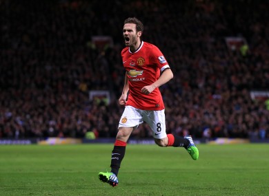 Manchester United's Juan Mata celebrates scoring his side's opening goal.