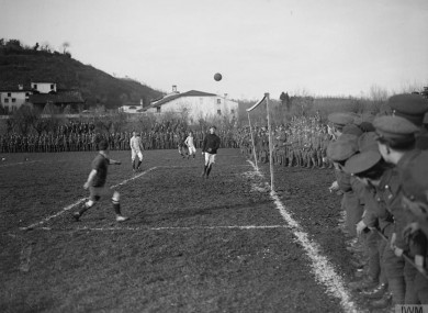 The ball is crossed into the box as British Army troops play in the final of the Fanshawe Cup in Trissino, Italy.