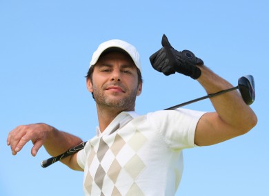 File photo of a rich man playing golf.