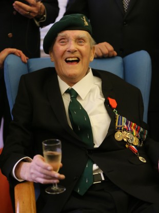 Pat Gillen celebrates as he receives the (Legion d'Honneur) Legion of Honour from French Ambassador Jean-Pierre Thebault at Mercy Hospital in Cork.