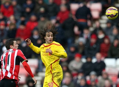 Liverpool's Lazar Markovic, right, vies for the ball with Sunderland's Adam Johnson.