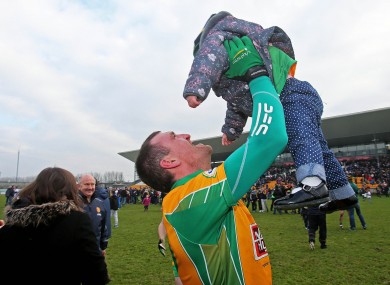 Corofin's Gary Delaney celebrates with his daughter Kaya after the game.