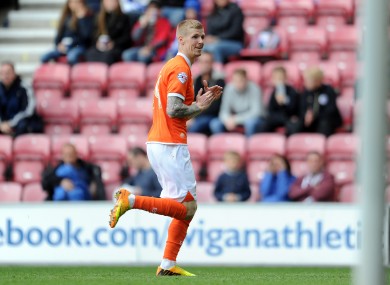 Keogh celebrates a goal during his time with Blackpool.