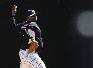 Sabathia throws in the bullpen during the first day of workouts.