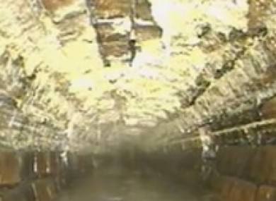 Screengrab of vidoe footage of drain workers looking for fatberg in London sewer.
