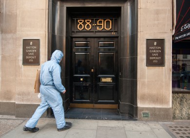 A police forensics officer enters the Hatton Garden Safe Deposit company.