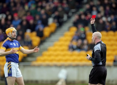 Referee John Keenan shows a red a card to Seamus Callanan of Tipperary.