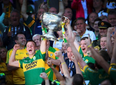 Fionn Fitzgerald and Kieran O'Leary lift the Sam Maguire.