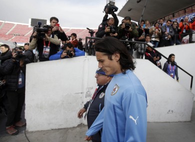 Uruguay's Edinson Cavani enters the field for training during the Copa America tournament at the National Stadium in Santiago, Chile earlier.
