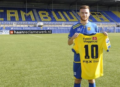 Jack Byrne poses with his new jersey.