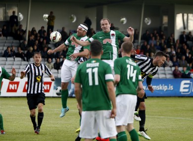 Cork City's Mark O'Sullivan and Colin Healy compete in the air.