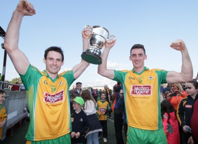 Corofin's Kieron Molloy and Ciaran McGrath celebrate with the Frank Cox Cup.