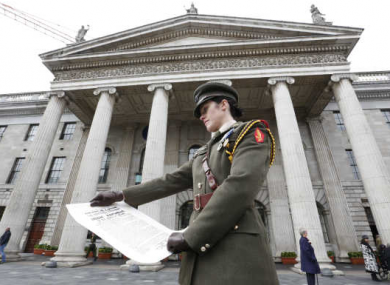 Irish Army Captain Kate Hanrahan with the Irish Republic proclamation at the official commemoration of the 1916 Easter Rising in April.