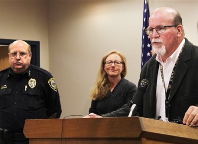 Canon City Police Chief Paul Schultz, left, and Crime Prevention Coordinator Jen O'Connor listen as Superintendent George Welsh talks about a sexting scandal at Canon City High School during a news conference in Canon City.