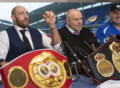 Fury, left, with his IBF belt after shocking Klitschko.