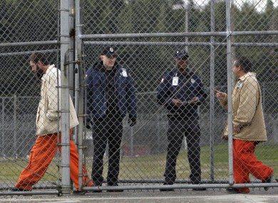 Inmates walk past correctional officers at the Washington Corrections Centre (File photo)