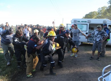 An injured man is taken away by emergency personnel after the horrific incident.