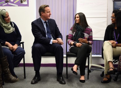 David Cameron meets women attending an English language class during a visit to the Shantona Women's Centre in Leeds.