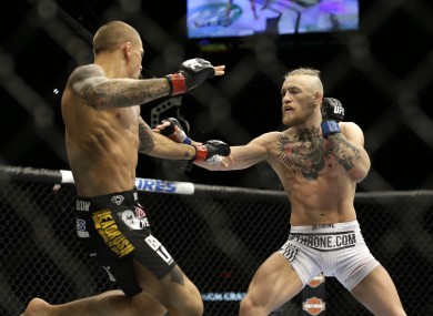 Dustin Poirier and Conor McGregor in action during their September 2014 bout in Las Vegas.