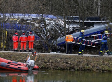Rescue personnel standing in front of the two collided trains